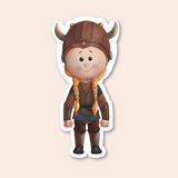 A sticker of a girl dressed as a shieldmaiden in Viking attire, complete with a brown helmet adorned with horns.