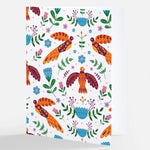 A white notecard adorned with a colorful Nordic-inspired pattern featuring stylized orange birds and a variety of floral elements, from The Uff Da Sisters.