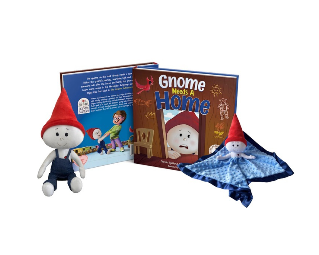 The children's book "Gnome Needs A Home" is displayed open alongside a plush gnome doll and a comforting gnome lovey blanket. The doll and lovey both feature a gnome character with a red hat, mirroring the book's charming theme. The book's cover shows a worried gnome character and the interior pages offer engaging text and colorful illustrations.